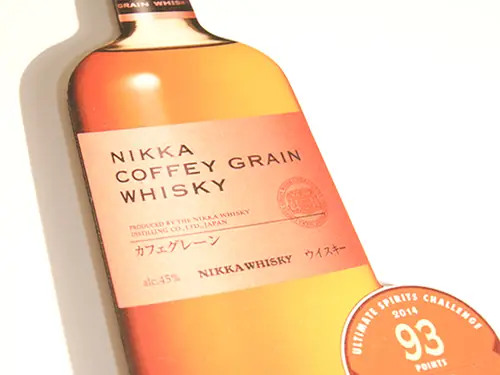 Die-cut piece shaped like a bottle of Nikka Coffey Grain Whisky