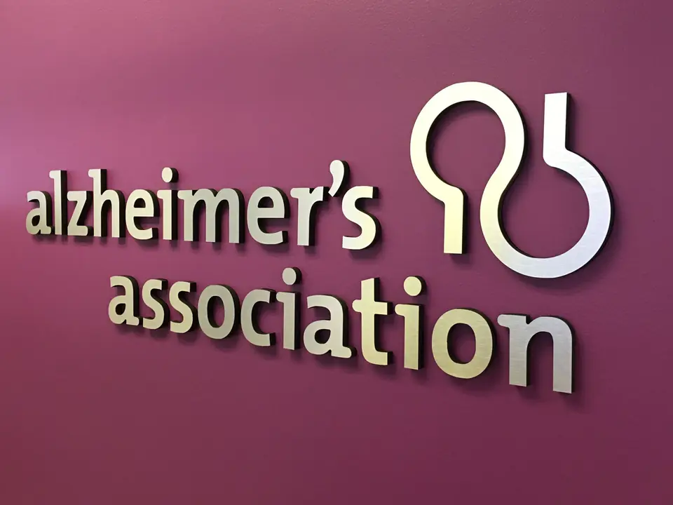 Raised Alzheimer&rsquo;s Association logo on a purple accent wall