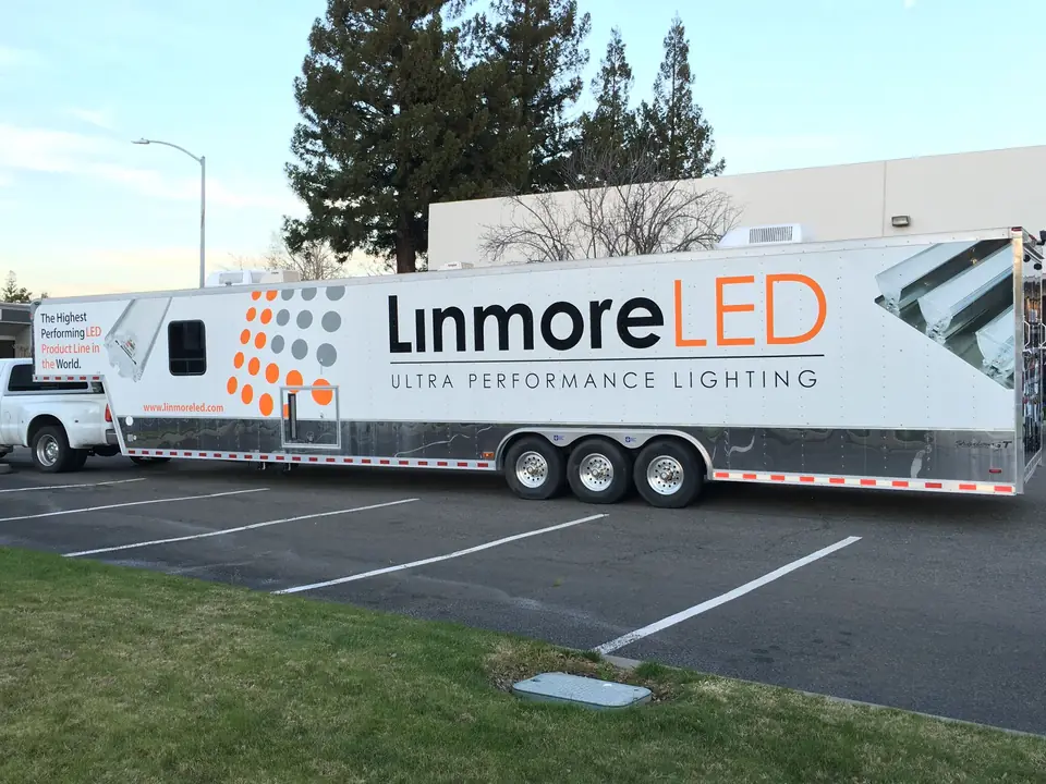 Full wrap on a Linmore LED trailer in a parking lot